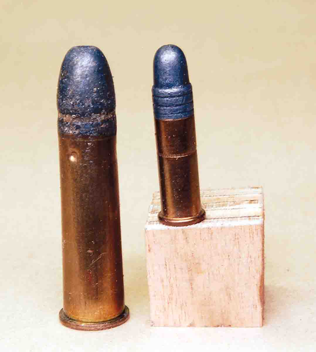 The .310 Cadet used an outside lubed bullet (left) just like the .22 rimfire (right).